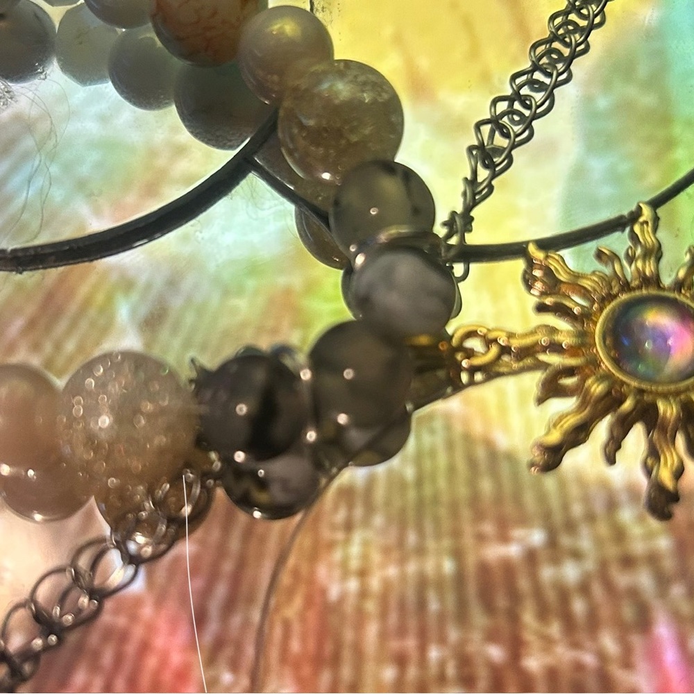 Elegant Gold and Silver Sun Pendant Bracelet